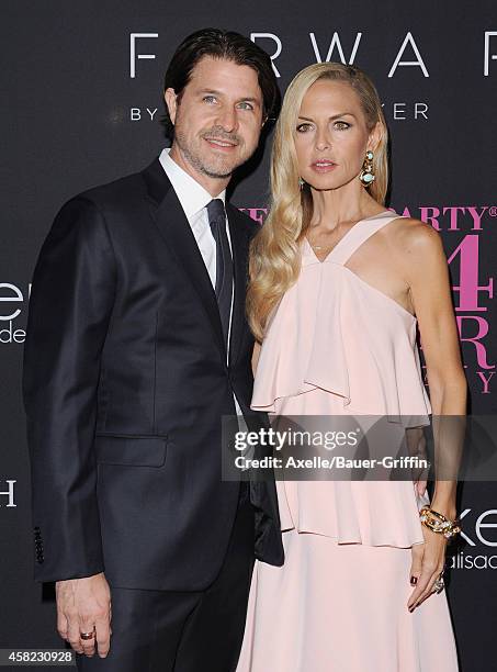 Roger Berman and fashion stylist Rachel Zoe arrive at the 10th Annual Pink Party held at Santa Monica Airport on October 18, 2014 in Santa Monica,...
