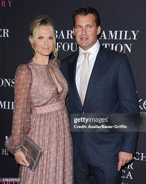 Actress/model Molly Sims and husband/producer Scott Stuber arrive at the 10th Annual Pink Party held at Santa Monica Airport on October 18, 2014 in...