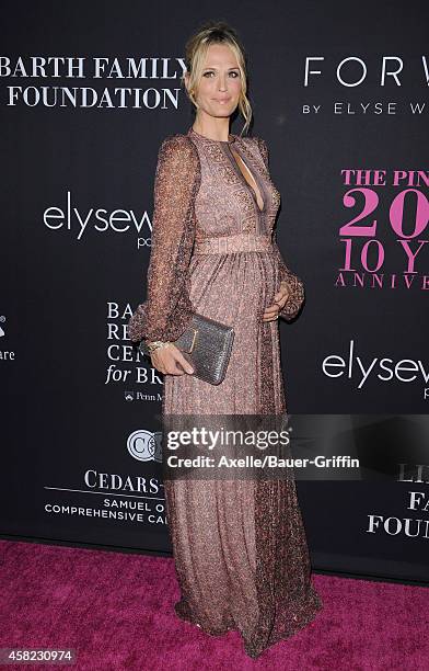 Actress/model Molly Sims arrives at the 10th Annual Pink Party held at Santa Monica Airport on October 18, 2014 in Santa Monica, California.