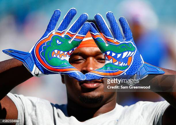 Adam Lane of the Florida Gators displays his gloves before the game against the Georgia Bulldogs at EverBank Field on November 1, 2014 in...