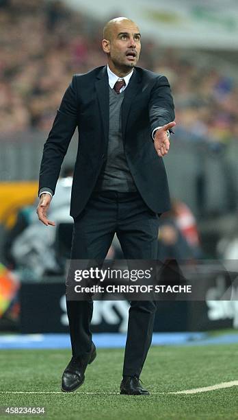 Bayern Munich's Spanish head coach Pep Guardiola reacts during the German first division Bundesliga football match FC Bayern Munich vs Borussia...