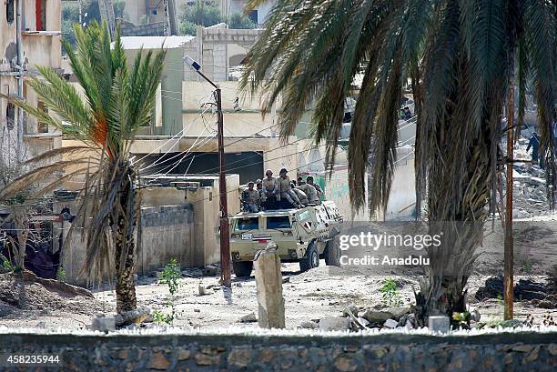 An armoured vehicle of Egyptian army is seen as they blow up buildings as part of an operation aiming to create a buffer zone at the Rafah border in...
