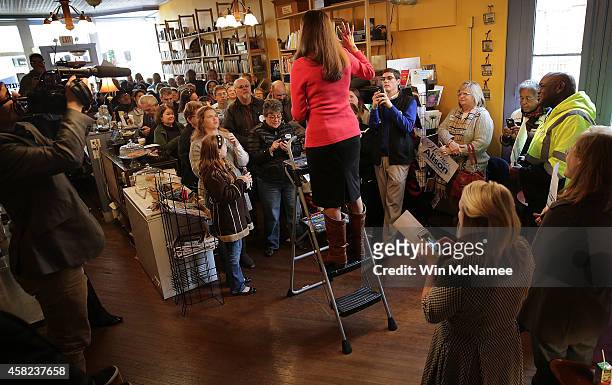 Democratic Senate candidate and Kentucky Secretary of State Alison Lundergan Grimes addresses Kentucky voters from the top of a ladder during a...