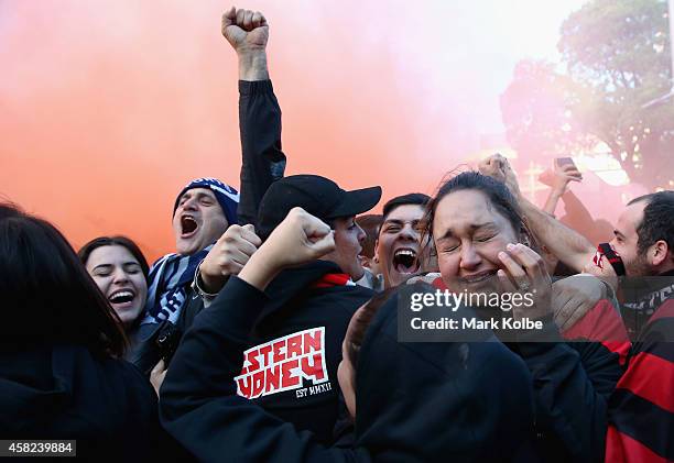 Wanderers fans cheer as they celebrate victory after watching the Asian Champions League final match between Western Sydney Wanders and Al Hilal at...