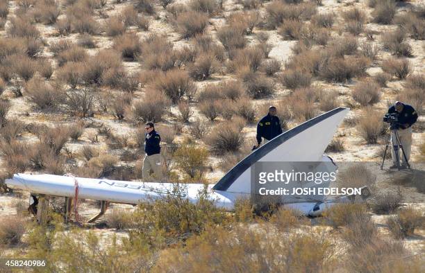 An National Transportation Safety Board team surveys a tail section from the crashed Virgin Galactic SpaceShipTwo near Cantil, California, on...