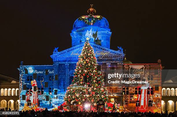light and sound show on federal palace of switzerland building - bern christmas stock pictures, royalty-free photos & images