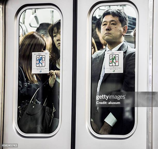 tokyo subway japan - busy train stock pictures, royalty-free photos & images