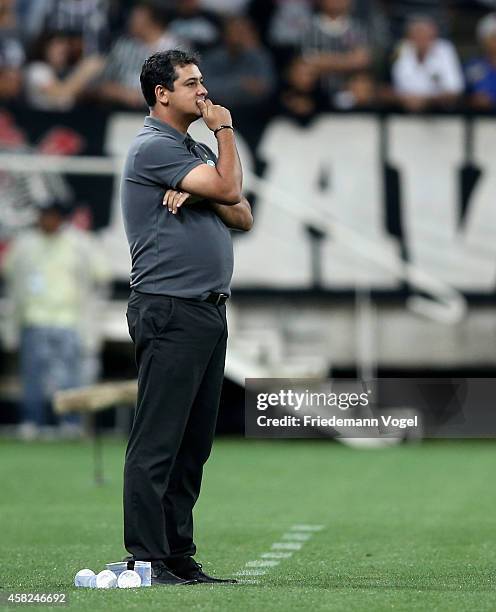 Head coach Marquinhos Santos of Coritiba looks on during the match between Corinthians and Coritiba for the Brazilian Series A 2014 at Arena...