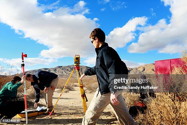 Agents from the NTSB and the FBI survey the debris from SpaceShipTwo out in a desert field near to the crash site on November 1 in Mojave,...