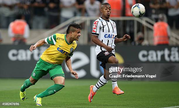 Malcom of Corinthians fights for the ball with Ivan of Coritiba during the match between Corinthians and Coritiba for the Brazilian Series A 2014 at...