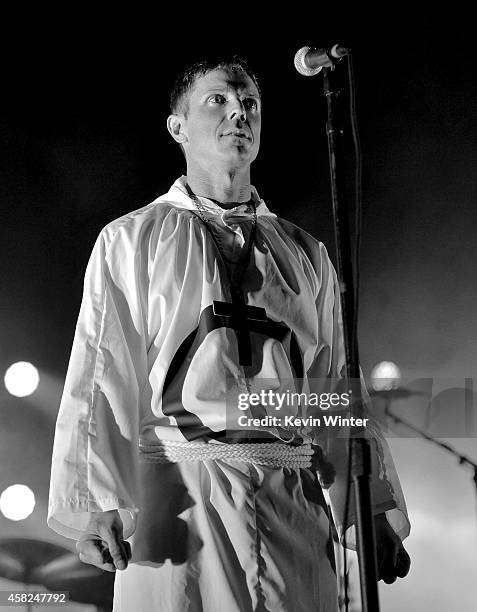 Singer Jake Shears of Scissor Sisters performs with Queens of the Stone Age at the Forum on October 31, 2014 in Inglewood, California.