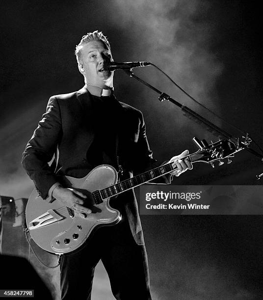 Musician Josh Homme of Queens of the Stone Age performs at the Forum on October 31, 2014 in Inglewood, California.