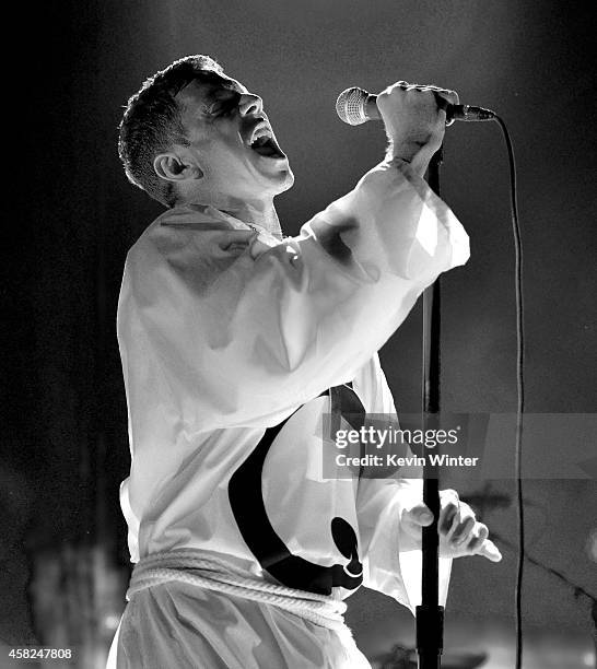 Singer Jake Shears of Scissor Sisters performs with Queens of the Stone Age at the Forum on October 31, 2014 in Inglewood, California.