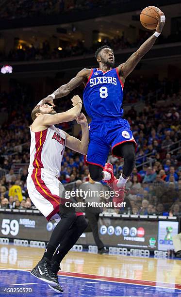 Tony Wroten of the Philadelphia 76ers attempts a layup with Josh McRoberts of the Miami Heat defending on the play on November 1, 2014 at the Wells...