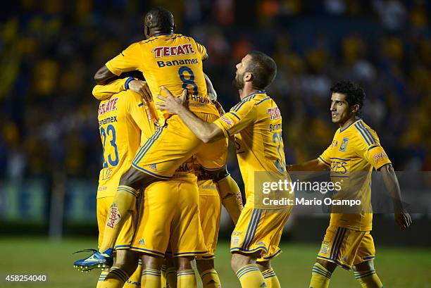 Anselmo Vendrechovski 'Juninho' of Tigres celebrates with teammates after scoring his team's first goal during a match between Tigres UANL v...