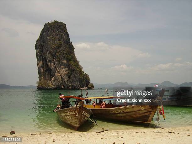 long tail boats moored in koh poda, krabi - thailand - koh poda stock pictures, royalty-free photos & images