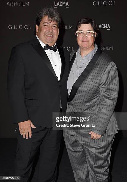 Curator Paul Schimmel and Cathy Opie attend the 2014 LACMA Art + Film Gala honoring Barbara Kruger and Quentin Tarantino at LACMA on November 1, 2014...