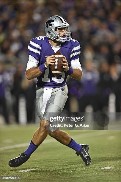 Quarterback Jake Waters of the Kansas State Wildcats drops back to pass against the Oklahoma State Cowboys during the first half on November 1, 2014...