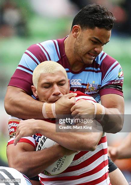 Ryan Hall of England is tackled by Dylan Walker of Australia during the Four Nations match between the Australian Kangaroos and England at AAMI Park...