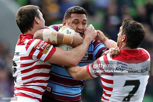 Josh Papalii of Australia is tackled during the Four Nations match between the Australian Kangaroos and England at AAMI Park on November 2, 2014 in...