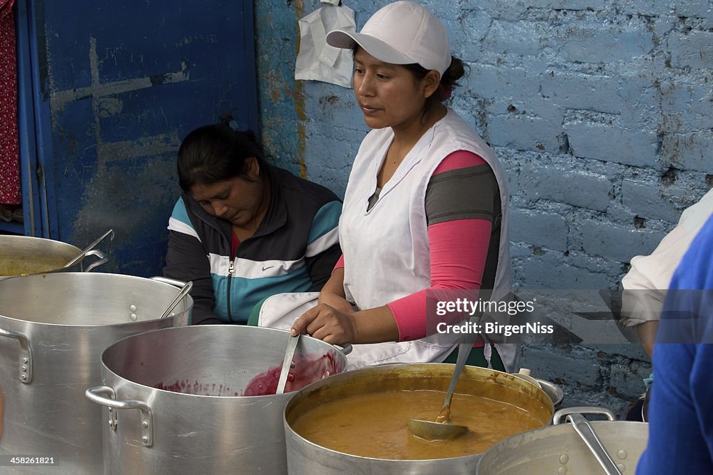 Young girl selling sweet porridges in Huamanga, Peru