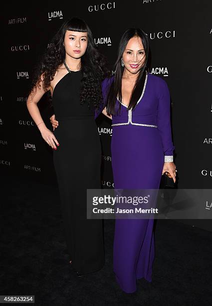 Asia Chow and LACMA Truste and Art + Film Gala Co-Chair Eva Chow, wearing Gucci, attend the 2014 LACMA Art + Film Gala honoring Barbara Kruger and...