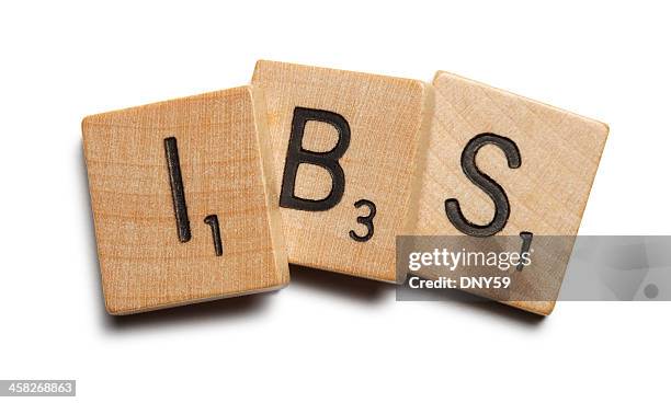 wooden scrabble tiles spelling "ibs" - irritable bowel syndrome stock pictures, royalty-free photos & images