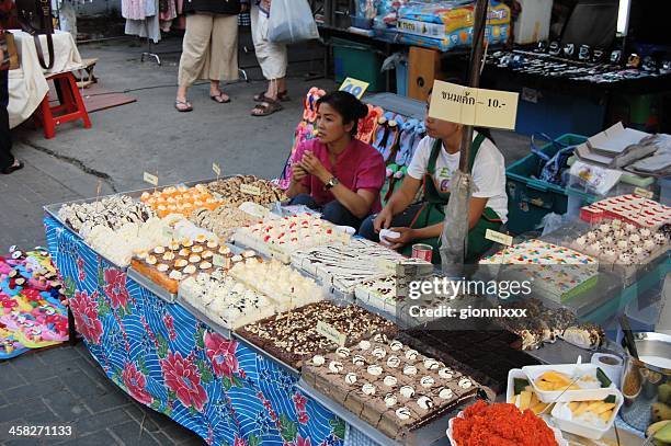 cake seller, chiang mai - thailand - chiang mai sunday market stock pictures, royalty-free photos & images