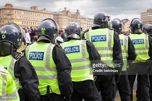 police in riot gear at the english defence league rally - bradford england stock pictures, royalty-free photos & images