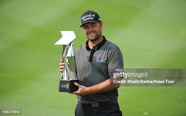 Ryan Moore of USA poses with the trophy during day four of the 2014 CIMB Classic at Kuala Lumpur Golf & Country Club on November 2, 2014 in Kuala...