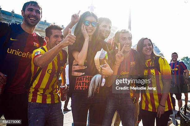 Chinese model Ming Xi exits the Chanel show with some FC Barcelona football fans at Grand Palais on Day 8 of Paris Fashion Week Spring/Summer 2015 on...