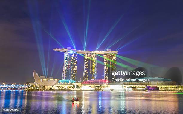 singapore marina bay sands hotel colourful laser lightshow - fame park stock pictures, royalty-free photos & images