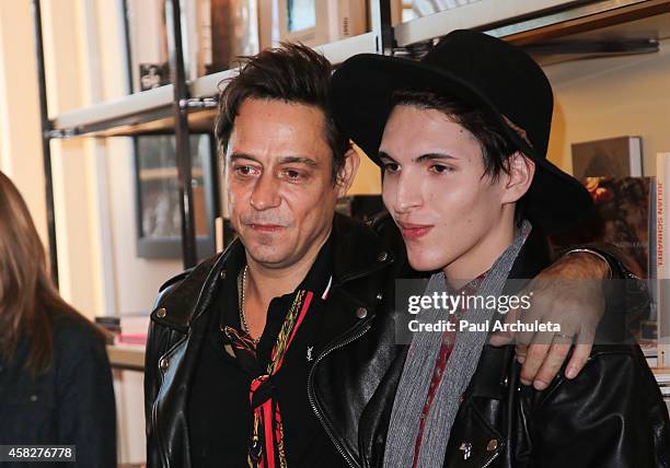 Jamie Hince of the Rock Band Kills signs for fans copies of his new book "Echo Home" at BookMarc on November 1, 2014 in Los Angeles, California.