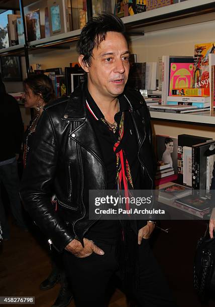 Jamie Hince of the Rock Band Kills signs for fans copies of his new book "Echo Home" at BookMarc on November 1, 2014 in Los Angeles, California.