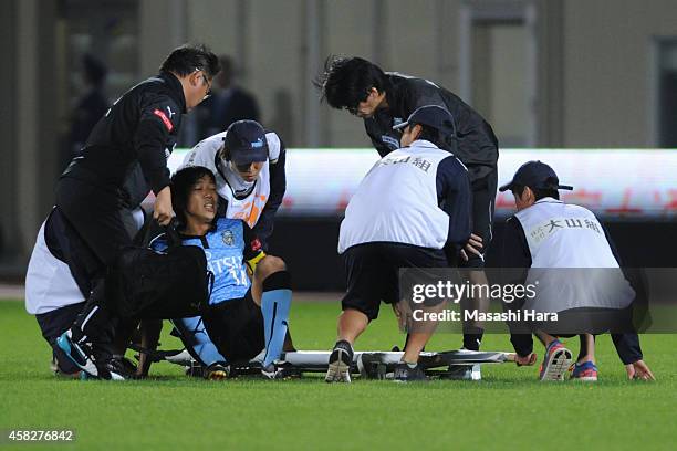 Kengo Nakamura of Kawasaki Frontale is injured during the J.League match between Kawasaki Frontale and Shimzu S-Pulse at Todoroki Stadium on November...