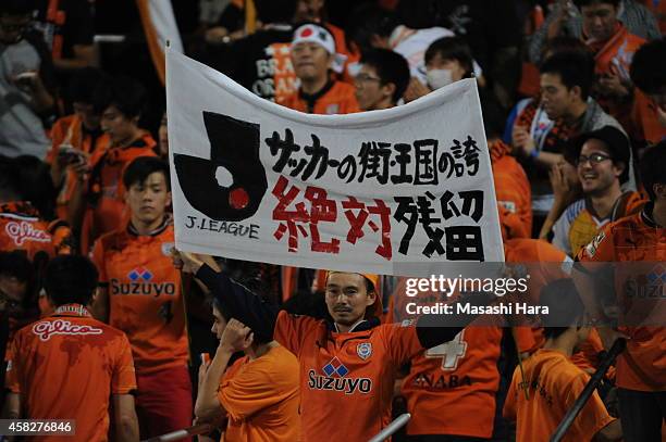 Shimizu S-Pulse supporter holds a meesage of promotion after the J.League match between Kawasaki Frontale and Shimzu S-Pulse at Todoroki Stadium on...