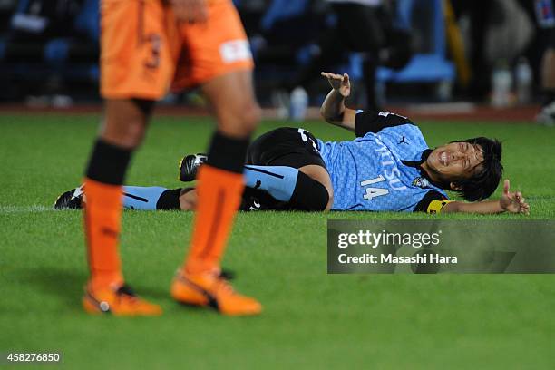 Kengo Nakamura of Kawasaki Frontale is injured during the J.League match between Kawasaki Frontale and Shimzu S-Pulse at Todoroki Stadium on November...