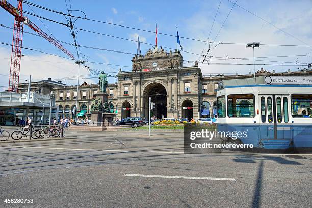 tram pass train station - tram zürich stock pictures, royalty-free photos & images