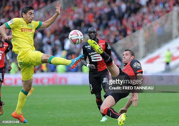 Nantes' US midfielder Alejandro Bedoya vies for the ball with Rennes' French defender Sylvain Armand during the French L1 football match Nantes vs...