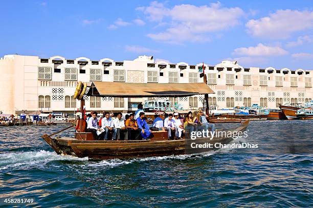 dubai, uae - abra or water-taxi on the creek - dubai taxi stock pictures, royalty-free photos & images