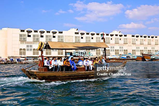 dubai, uae - abra or water-taxi on the creek - dubai deira stock pictures, royalty-free photos & images