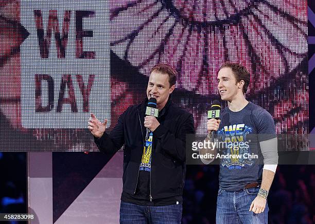 Marc and Craig Kielburger, international activists and co-founders of We Day speak during 'We Day Vancouver' at Rogers Arena on October 22, 2014 in...