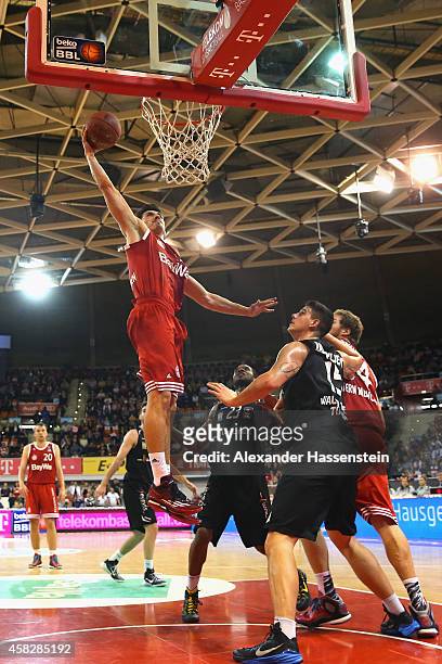 Nihad Djedovic of Muenchen scores a point during the Beko Basketball Bundesliga match between FC Bayern Muenchen and WALTER Tigers Tuebingen at...