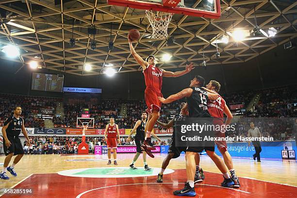 Nihad Djedovic of Muenchen scores a point during the Beko Basketball Bundesliga match between FC Bayern Muenchen and WALTER Tigers Tuebingen at...