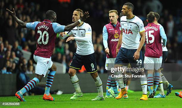 Villa player Christian Benteke confronts Roberto Soldado of Spurs before being sent off during the Barclays Premier League match between Aston Villa...