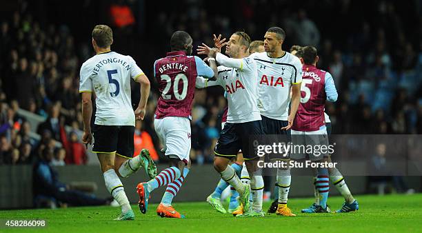 Villa player Christian Benteke confronts Roberto Soldado of Spurs before being sent off during the Barclays Premier League match between Aston Villa...