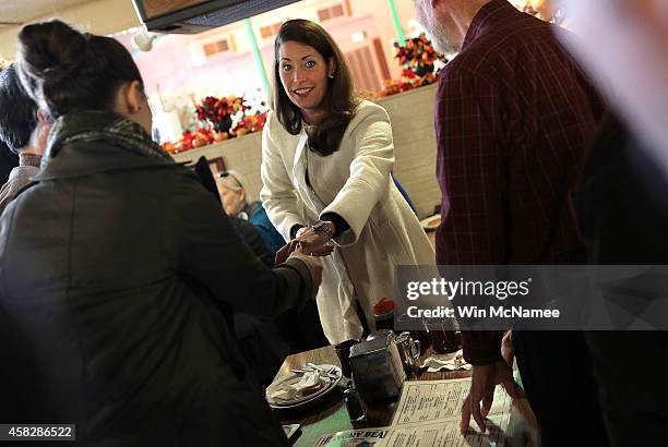 Democratic Senate candidate and Kentucky Secretary of State Alison Lundergan Grimes greets Kentucky voters during a campaign stop at the Hungry Bear...