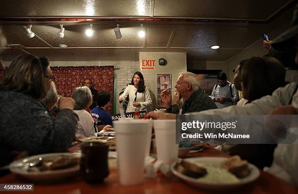 Democratic Senate candidate and Kentucky Secretary of State Alison Lundergan Grimes speaks to Kentucky voters during a campaign stop at the Hungry...