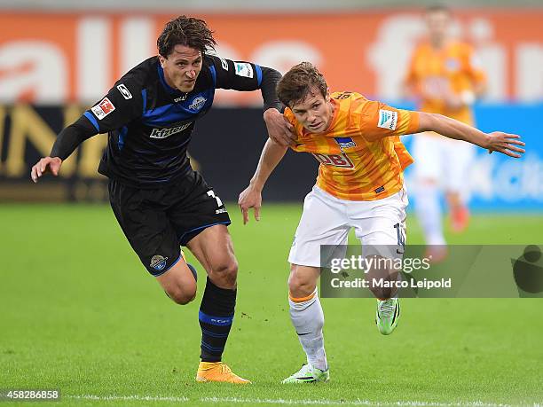 Jens Wemmer of SC Paderborn 07 and Valentin Stocker of Hertha BSC during the game between SC Paderborn 07 against Hertha BSC on november 2, 2014 in...