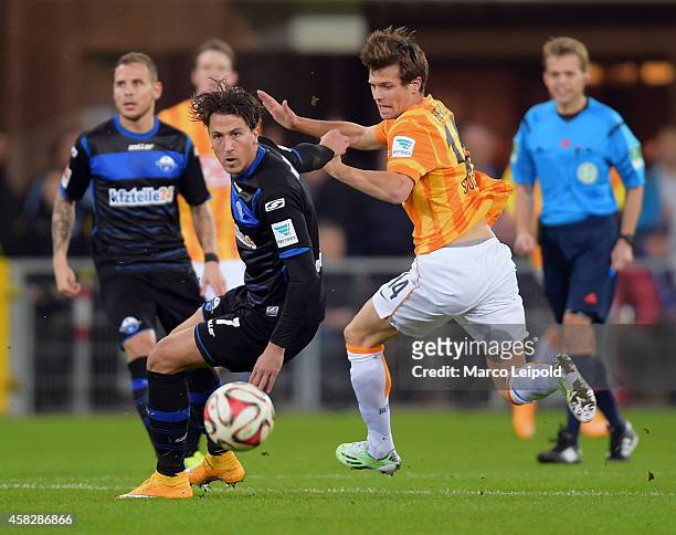 Jens Wemmer of SC Paderborn 07 and Valentin Stocker of Hertha BSC during the game between SC Paderborn 07 against Hertha BSC on november 2, 2014 in...